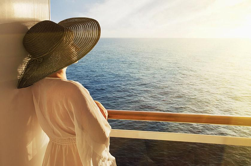 A woman looks at the sea on a cruise
